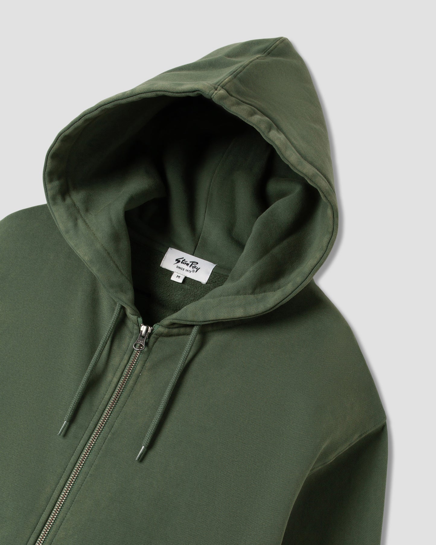 Capuche zippée avec patch (vert délavé)