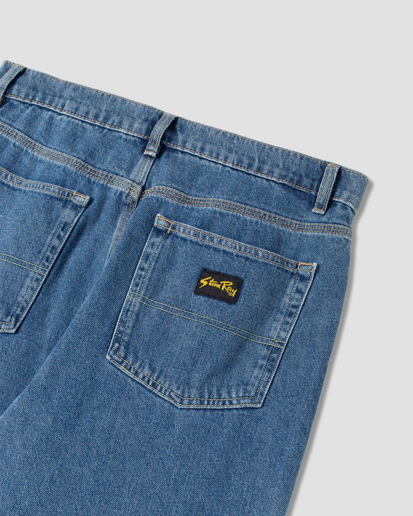Taper 5 Jeans (schwerer Stone Wash Denim)